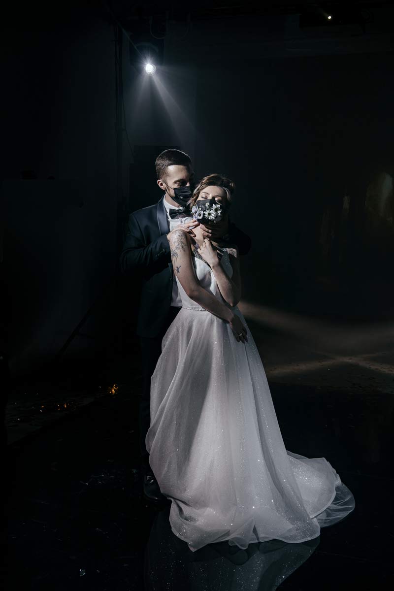 Wedding couple wearing COVID face masks